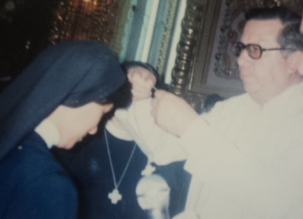 Fr. Salvador  Nuñez Lopez, from the Diocese of Zamora, Michoacán, Mexico, gives the author her cross on the day of her profession at the Sanctuary of Our Lady of Guadalupe in Morelia, Michoacan, on Aug. 15, 1990. (Courtesy of Maria Elena Mendez Ochoa)