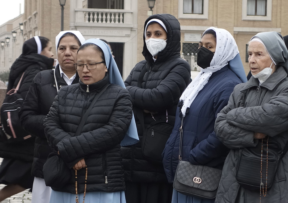 Nuns wait in line to enter St. Peter's Basilica to view the body of Pope Benedict XVI at the Vatican Jan. 2. (CNS/Jennifer Haring)
