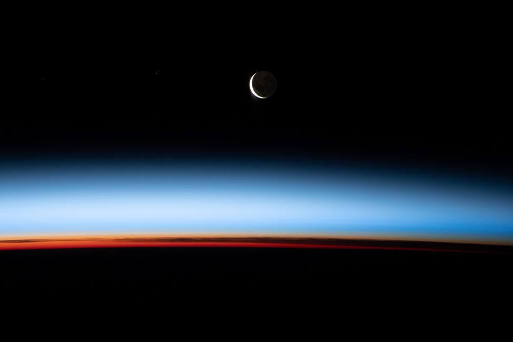 A waxing crescent moon is photographed from the International Space Station.