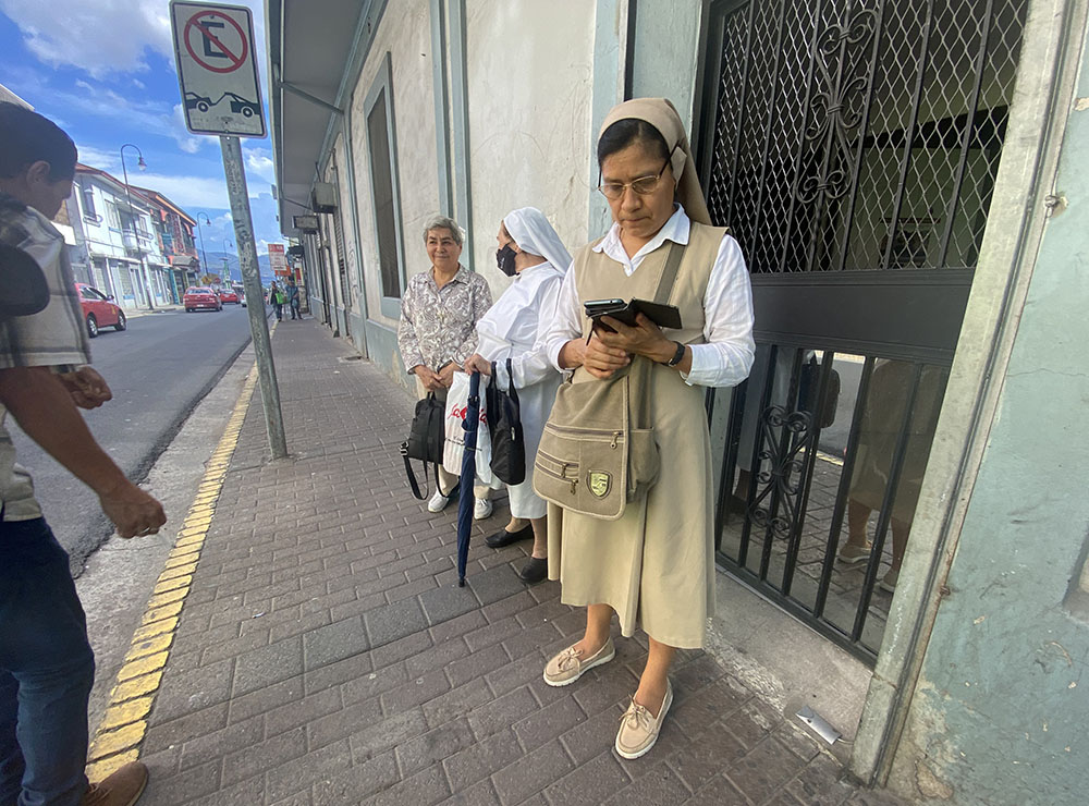Sr. Verónica Cortez Méndez waits, along with other women religious, at the door of the office of the migrant ministry of the Archdiocese of San José, Costa Rica, March 30. The Carmelite missionary sister is part of a group that has helped women religious tend to the waves of migrants passing through the Central American nation. (GSR photo/Rhina Guidos)