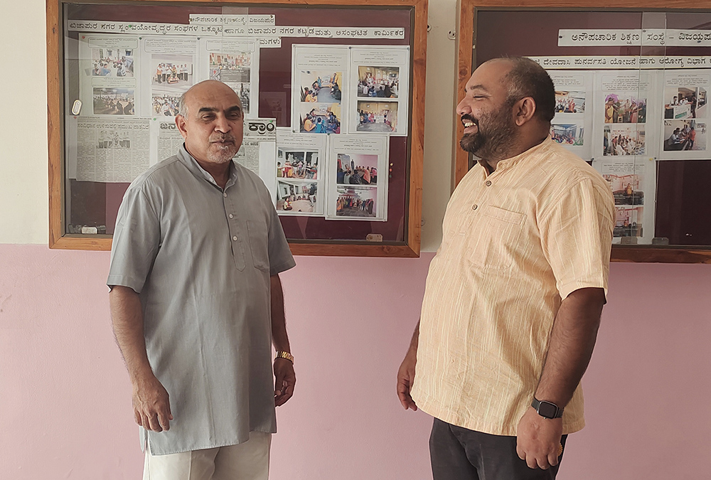 Jesuit mission superior Fr. Francis Menezes is pictured with Fr. Teyol Machado, director of Navachethana Centre for Non-Formal Education in Bijapur. (Thomas Scaria)