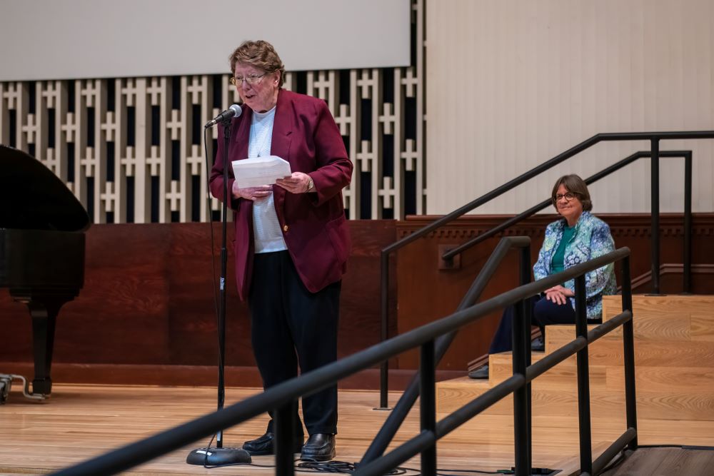 Sr. Lou Ella Hickman speaks about her poetry collection as Fern Jennings, president of the Cleveland Chamber Music Society, looks on. (Courtesy of Ronald Werman)