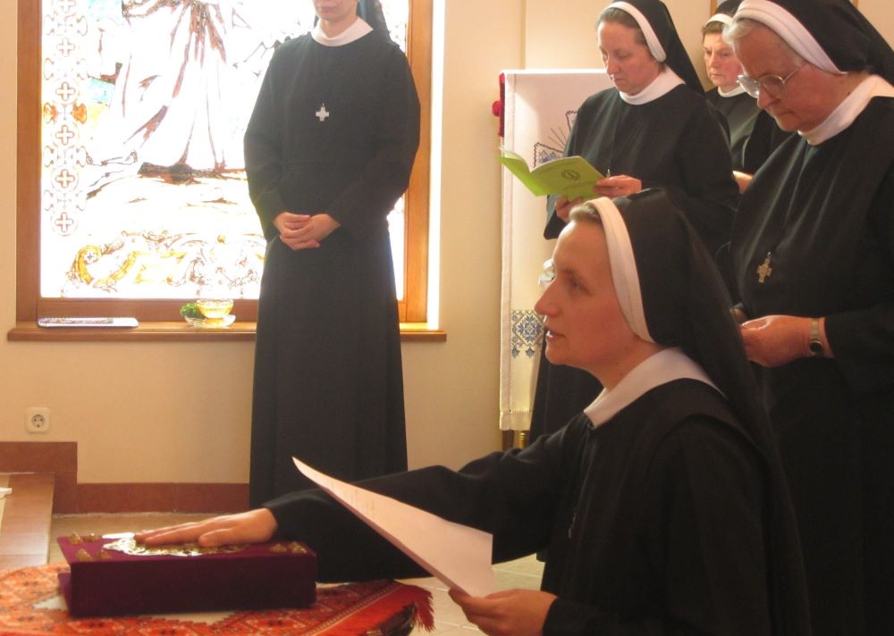 Sr. Teodozija Mostepaniuk makes her final profession as a Sister of the Order of St. Basil the Great (Province of St. Michael the Archangel, Croatia), placing her hand on the Gospel on April 29, 2018, in Osijek, Croatia. (Courtesy of Teodozija Mostepaniuk)