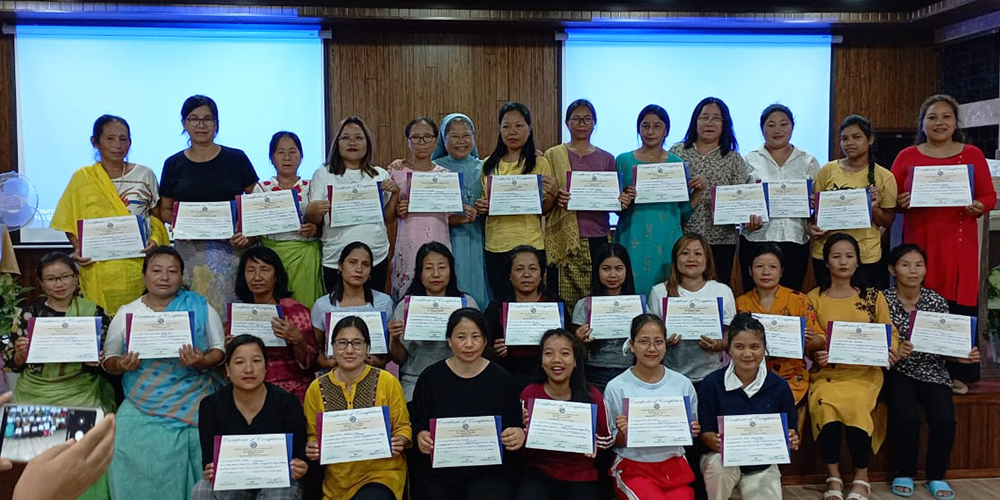 Missionary Sisters of Mary Help of Christians Sr. Rose Paite poses with the domestic workers who have completed their skills training from the Centre for Development Initiatives, managed by the congregation in Guwahati, Assam, northeastern India. (Courtesy of Sr. Rose Paite)