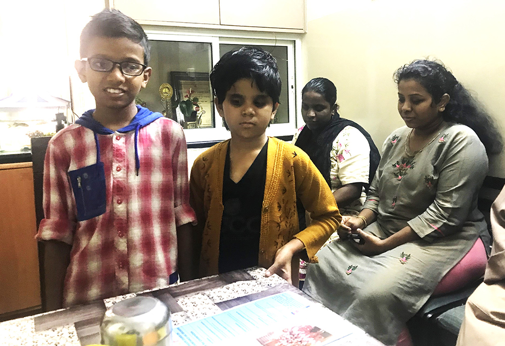 Johan Jernes (standing, far left) and Gracy Jessy (standing second from left), blind siblings from blind parents, are pictured with Satya, a music teacher (sitting), and Vinita Veerappan, IT employee (sitting far right) at Jyothi Seva Convent Hostel, managed by Franciscan Sisters Servants of the Cross in Bengaluru, southern India. (Thomas Scaria)