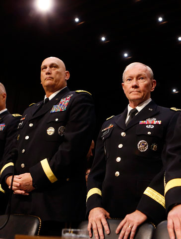 Gens. Raymond Odierno, left, and Martin Dempsey wait to testify on sexual assault in the military at a Senate Armed Services Committee in Washington June 4. (Reuters/Larry Downing)