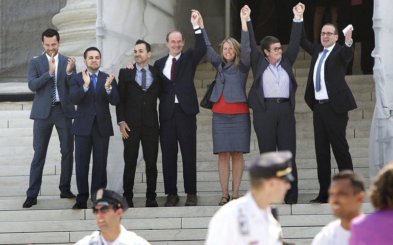 Attorney David Boies, left, stands with Jeff Zarrillo, second from left, Paul Katami, third from left, Sandy Stier, third from right, and Kris Perry, second from right, on the steps of the U.S. Supreme Court with supporters on Wednesday. Boies was lead attorney and the others were the four plaintiffs who challenged California's Proposition 8, the voter-approved initiative barring same-sex marriage. (CNS/Reuters/Jonathan Ernst)