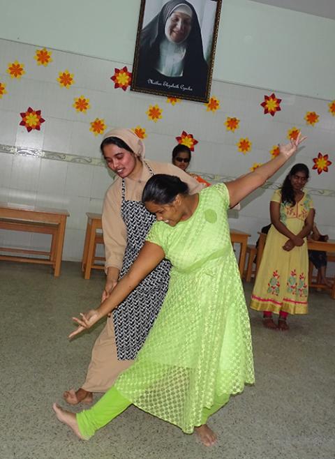 Franciscan Sisters Servants of the Cross Sr. Mary Rachel (behind) teaches dance to Najiran, a student of Jyothi Seva School for the Blind in the southern Indian city of Bengaluru. (Courtesy of Sr. Mary Clare)