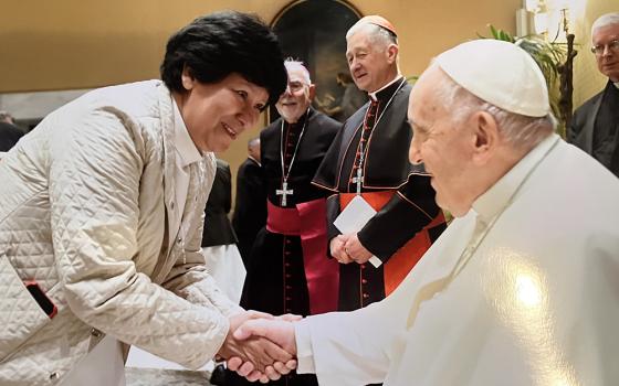 Sr. María Elena Méndez Ochoa of the Guadalupan Missionaries of the Holy Spirit greets Pope Francis in Rome in a private audience for a group of Latin American sisters and a Catholic Extension team April 26. (Courtesy of María Elena Méndez Ochoa from the printed photo taken by the Vatican)