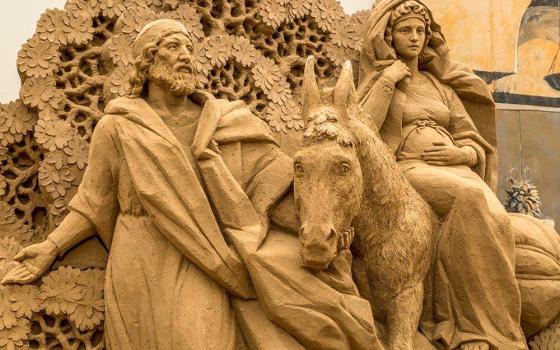 A depiction of Mary and Joseph's journey to Bethlehem sculpted from sand is displayed in the Italian resort town of Jesolo. (CNS/Jesolo Tourism Office)