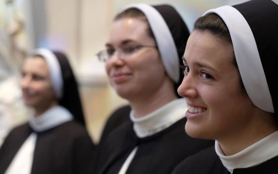 Members of the Dominican Sisters of St. Cecilia Congregation in Nashville, Tennessee, are pictured in a file photo preparing for Mass at the Cathedral of the Incarnation, where they made their final profession of religious vows. (OSV News/CNS file/Tennessee Register/Rick Musacchio)