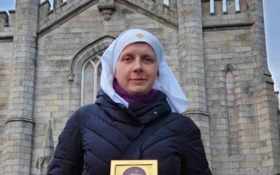 Sister Helen Volynets poses with an icon of Mary and the Christ Child outside Holy Apostles Peter and Paul Russian Orthodox Church in Harold's Cross in Dublin March 3, 2024.