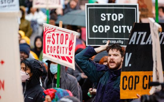 Demonstrators hold signs and chant slogans in Atlanta March 9, 2023, during a protest over plans to build a new $109.6 million, 85-acre police training center. (AP/Alex Slitz)