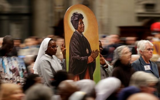 An image of Sudanese St. Josephine Margaret Bakhita, a Canossian Daughter of Charity, is carried in procession during a prayer service in 2017. (CNS/Reuters/Max Rossi)