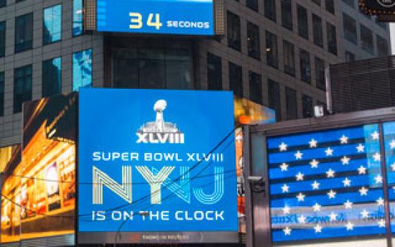 Promotions for Super Bowl XLVIII, to be held at MetLife Stadium in East Rutherford, N.J., Feb 2, are seen in Times Square in New York Dec. 29. (Newscom/Richard B. Levine)