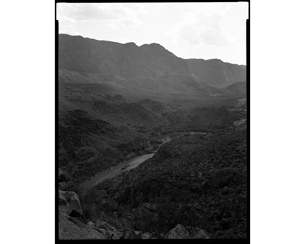 The Rio Grande between Lajitas and Presidio, Texas, looking at Mexico. "The beautiful landscape here is deceiving, and [there is] intensely rough terrain — desert heat, snakes, canyons, cliffs," Elmaleh says of this region with no wall. (© Lisa Elmaleh)