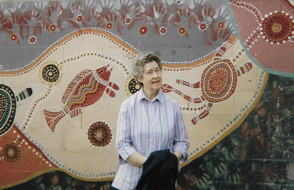 Sr. Esmey Herscovitch at the top of The Block near the sisters' house; the paintings on the wall were done by Indigenous people. (Courtesy of Esmey Herscovitch)