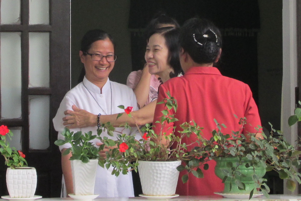 Daughters of Mary of the Immaculate Conception Sr. Joanna Tra Thi Quanh welcomes Catholic women to a celebration marking Mother's Day at her congregation in Hue City on May 10. (Peter Nguyen)