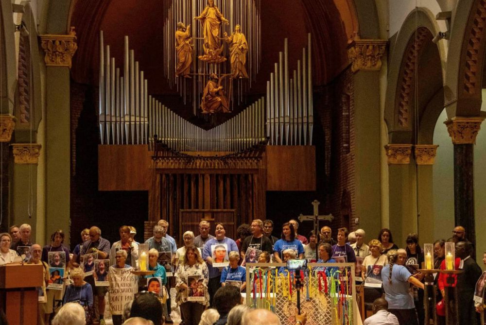 People gathered at St. Mary's Church altar Those willing to risk arrest at the protest gather at St. Mary's Church before the procession to the Federal Building in Newark, New Jersey. (Frank McCann)