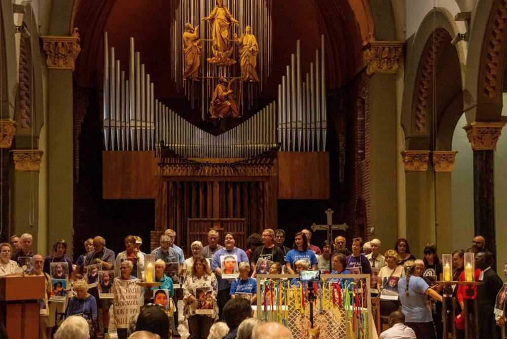 Those willing to risk arrest at the protest gather at St. Mary's Church before the procession to the Federal Building in Newark, New Jersey. (Frank McCann)