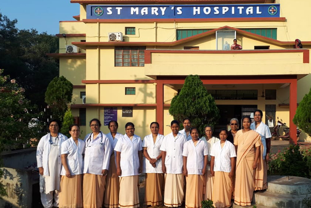 Handmaids of Mary Sisters are pictured outside St. Mary's Hospital in Jharsuguda, Odisha, India. The sisters serve at the hospital, and have continued their work during the pandemic. (Provided photo) Handmaids of Mary Sisters are pictured outside St. Mary's Hospital in Jharsuguda, Odisha, India. The sisters serve at the hospital, and have continued their work during the pandemic. (Provided photo)