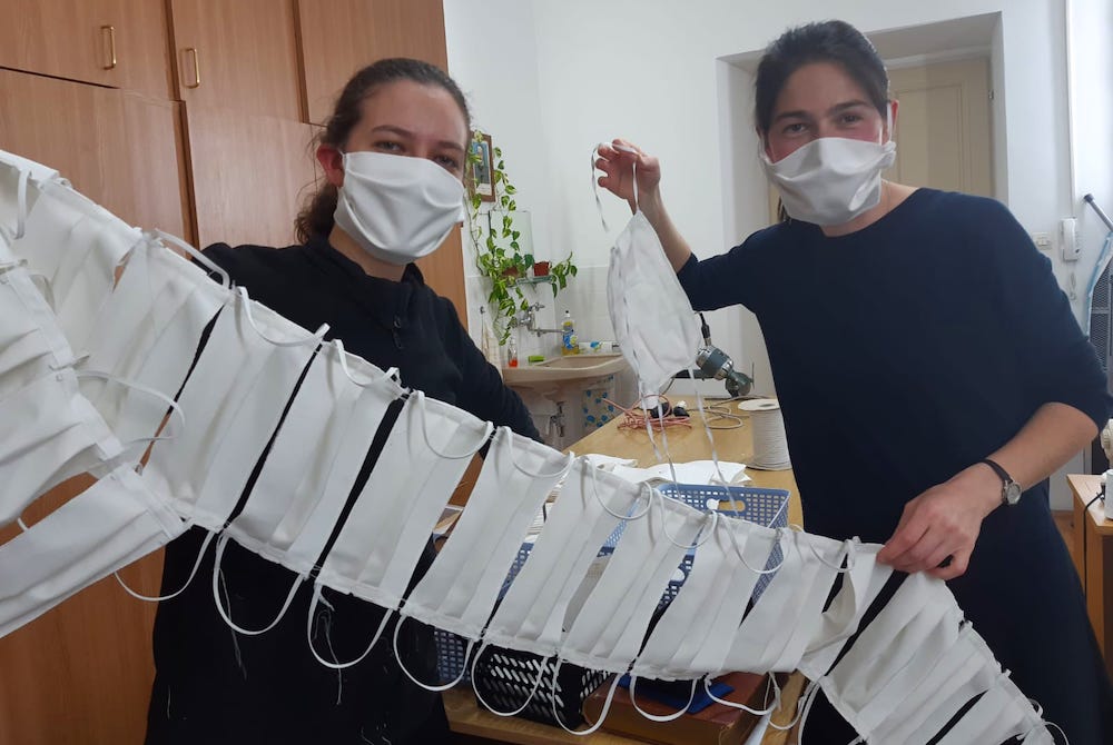 Candidates of Sisters of Mercy of the Holy Cross in Djakovo, Croatia, show a string of masks they have sewn to share with the people in the communities they serve. (Sr. Valerija Široki)