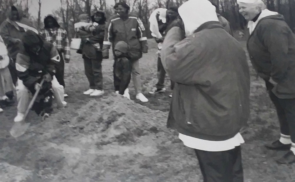 An outing for the residents of Dehon House in 1995. Dominican Sr. Lois McGovern is watching from the far right, as the residents plant a tree.  (Provided photo)