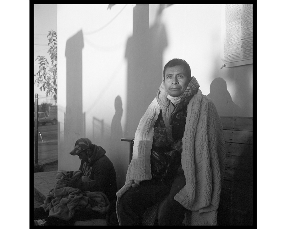 Two expelled migrants wait for the sun to come up at the Centro de Recursos para Migrantes (Migrant Resource Center) in Agua Prieta, Mexico. They were among the men expelled in the middle of the night in late October at the U.S.-Douglas, Texas, border.