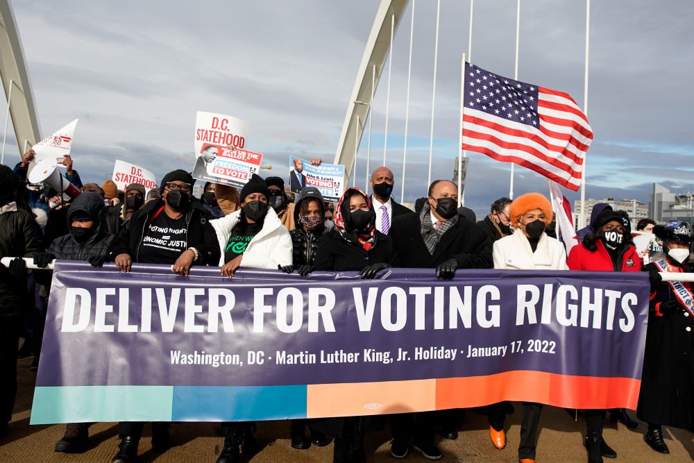 Martin Luther King III, the eldest son of late civil rights activist the Rev. Martin Luther King Jr., and his family take part in a Peace Walk on the Frederick Douglass Memorial Bridge in Washington Jan. 17.