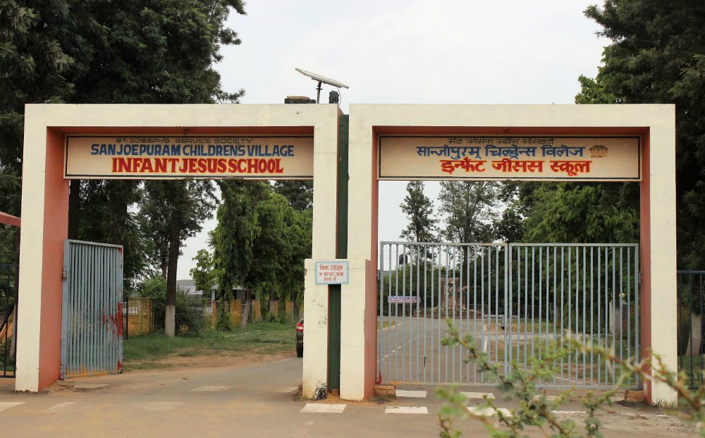 The entrance of Sanjoepuram Children's Village at Chandpur, a village in the Faridabad district of Haryana state, displays its name in both English and Hindi. (Jessy Joseph)