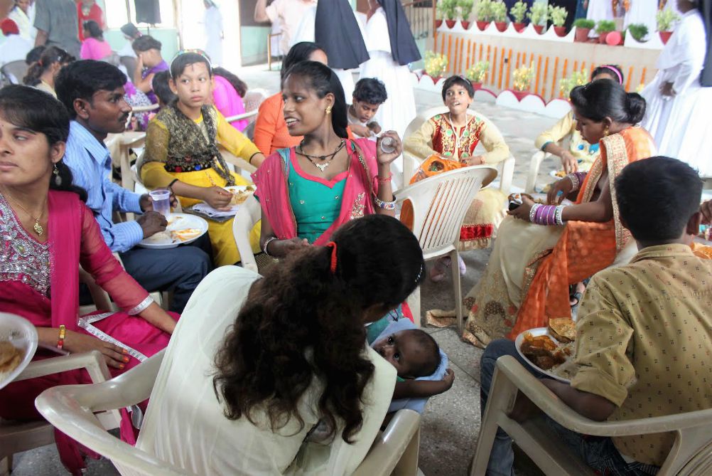 Children of Sanjoepuram share lunch served after the double wedding of two girls who grew up in the village. (Jose Kavi)