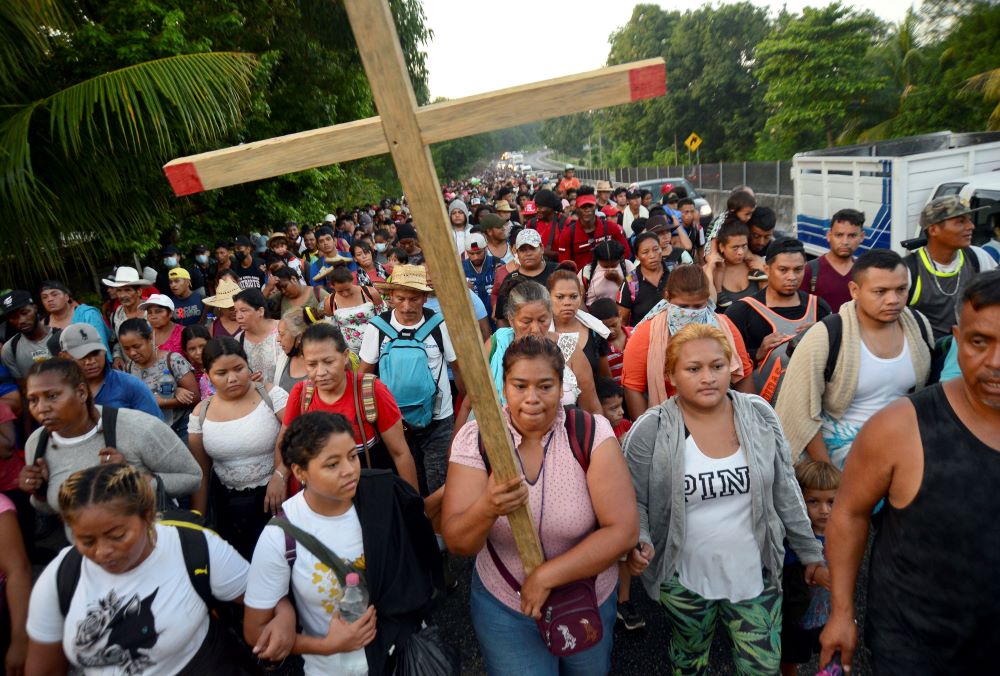 Migrants from Central America and Haiti walk in a caravan Oct. 25 near Huehuetan, Mexico, headed to Mexico City, where the migrants planned to apply for asylum or refugee status. (CNS/Reuters/Jacob Garcia)