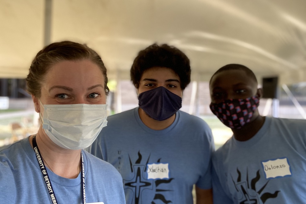 Sr. Erin McDonald of the Congregation of St. Joseph in Detroit, a chaplain at the University of Detroit Mercy, with campus interns Sebastian Rodriguez, center, and Dalonzo Curges, right, during the summer of 2020 (Provided photo)