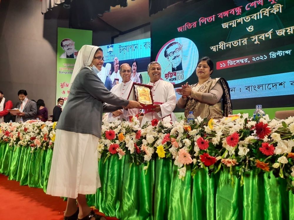 Sr. Juliet Jacquelin Gomes of the Sisters of Charity of Bartolomea Capitanio and Vincenza Gerosa on Dec. 11 accepts a "crest of recognition." (Courtesy of Juliet Jacquelin Gomes) 