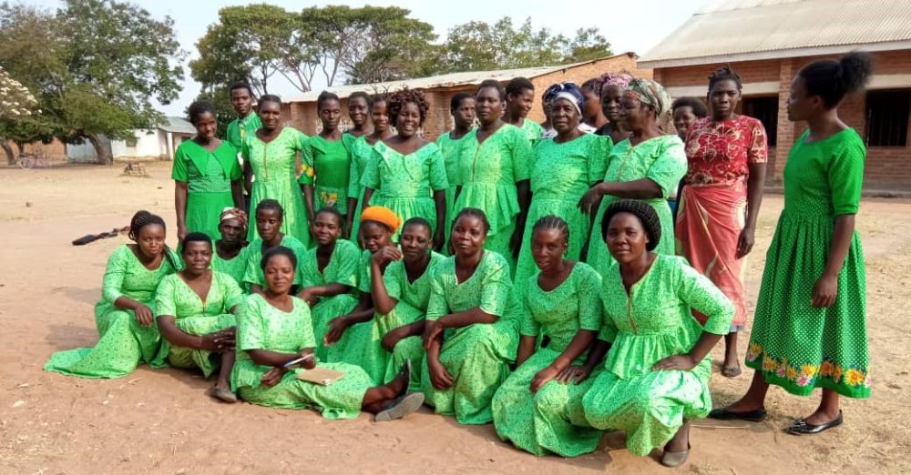 The Eco Women Group wear green to symbolize the environment. The sisters equip these women with skills to make briquettes, practice farming that does not adversely affect the environment and plant trees. (Photo courtesy of Sr. Patricia Chimimba) 