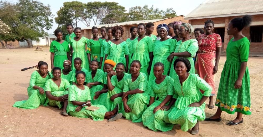 The Eco Women Group wear green to symbolize the environment. The sisters equip these women with skills to make briquettes, practice farming that does not adversely affect the environment and plant trees. (Photo courtesy of Sr. Patricia Chimimba)