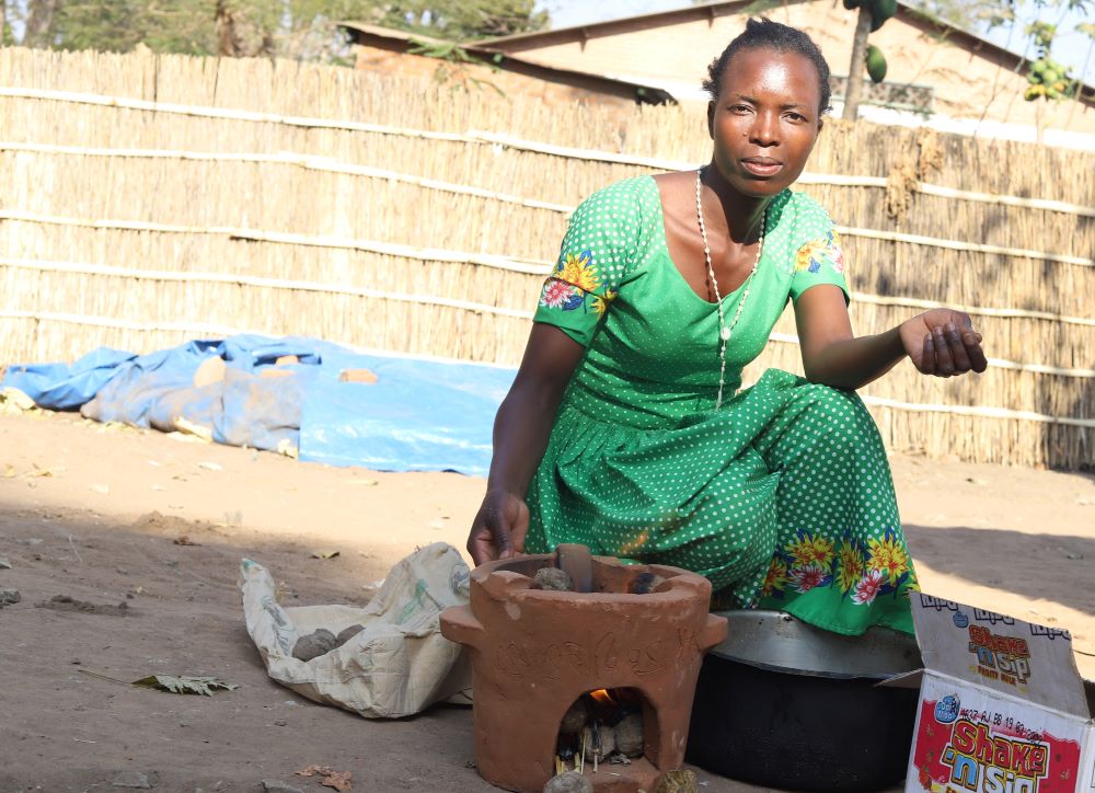 Marlene Usiku, 30, is a member of the Eco Women Group. After training from the sisters, she uses briquettes instead of charcoal or firewood to cook. (Doreen Ajiambo)