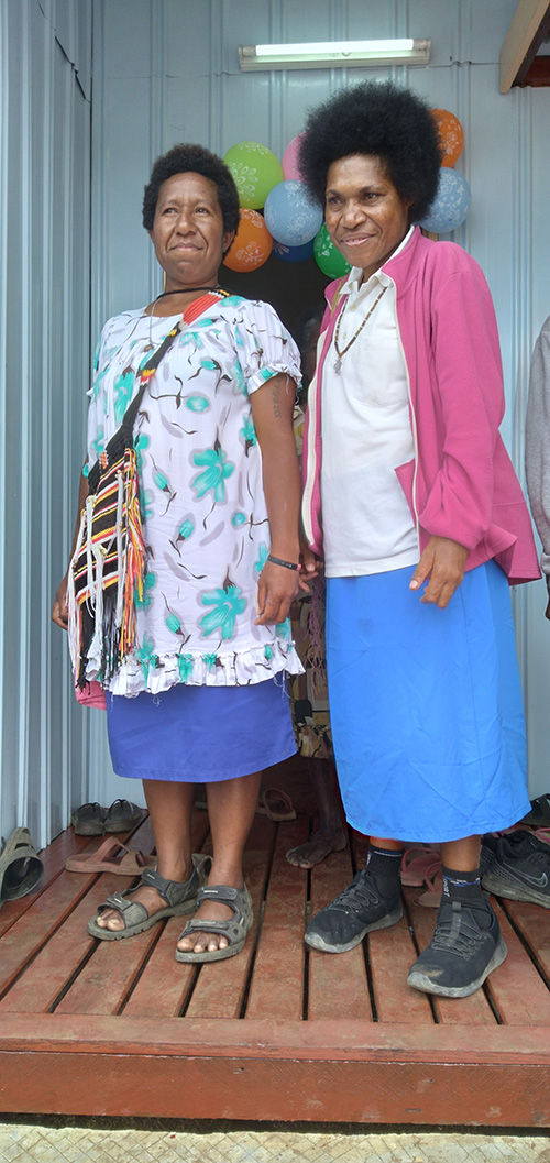 Srs. Maria Kuaga and Elizabeth Sep outside the new convent built by the local people in Pompabus in gratitude for the work the sisters are doing. (Courtesy of Anne Lane)