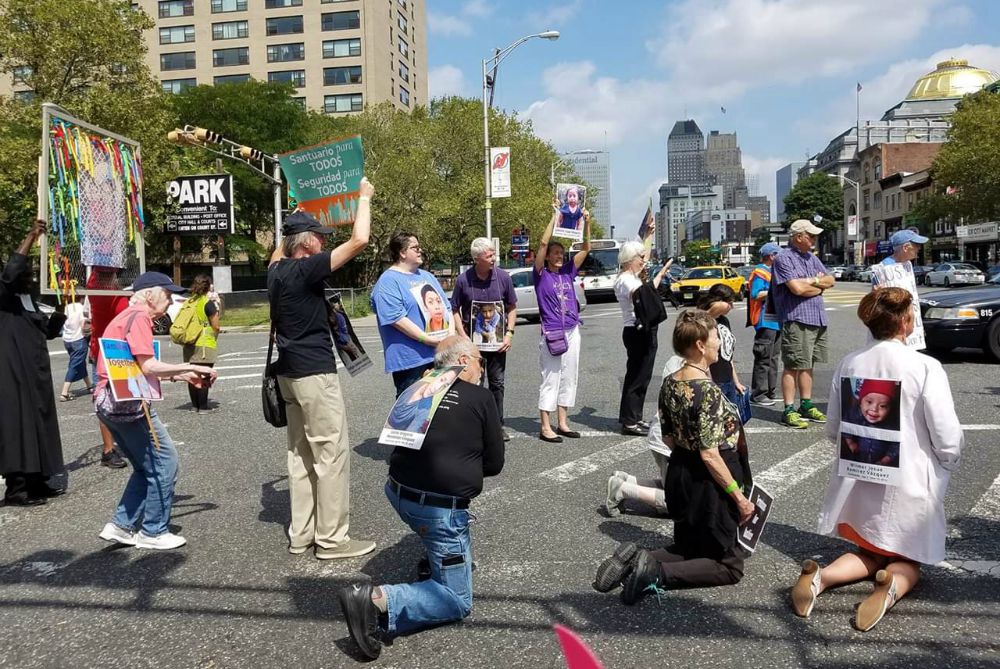 Susan Francois, in blue, stands in the intersection by the Federal Building. (Susan Whitsell)