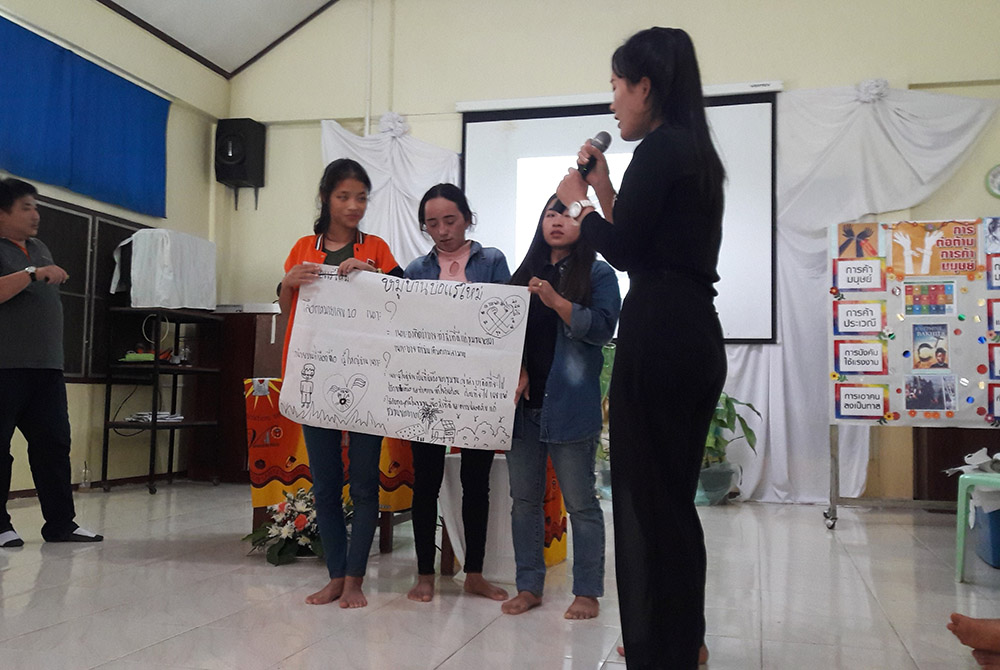 Group report during a human trafficking seminar A group gives a report during a human trafficking seminar. Presentation Sisters work with Good Shepherd Sisters to raise awareness about human trafficking among young people, who share the information with their village communities. (Frances Hayes)