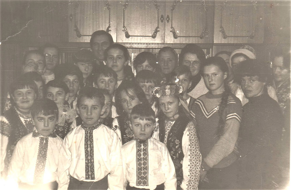 Children's concert after an underground liturgy in Lviv, Ukraine, 1989. In the background is Fr. Matej Havryliv, Ukrainian Catholic priest, the Basilian Sisters Sr. Anastazija Pitka and Sr. Terezija Sapun, and the Sisters of the Holy Family.