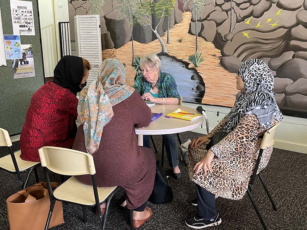 Volunteer Marie Tiller leads a language class for women refugees at Zara's House. (Tracey Edstein)