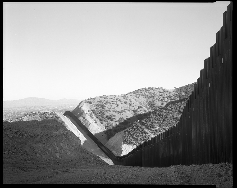 A view of the border wall looking toward Nogales, Arizona, on the left side of the wall, and Nogales, Mexico, on the right. Environmental activists and scientists say the 30-foot-high solid wall threatens animals such as jaguars and the Mexican gray wolf,
