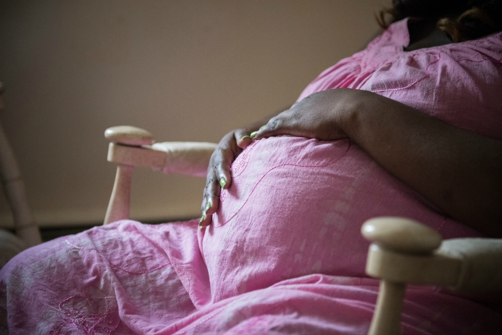 An expectant mother is seen in 2016 at a maternity home in Riverside, New Jersey, one of six pro-life maternity homes in the Good Counsel network. (CNS/Jeffrey Bruno)