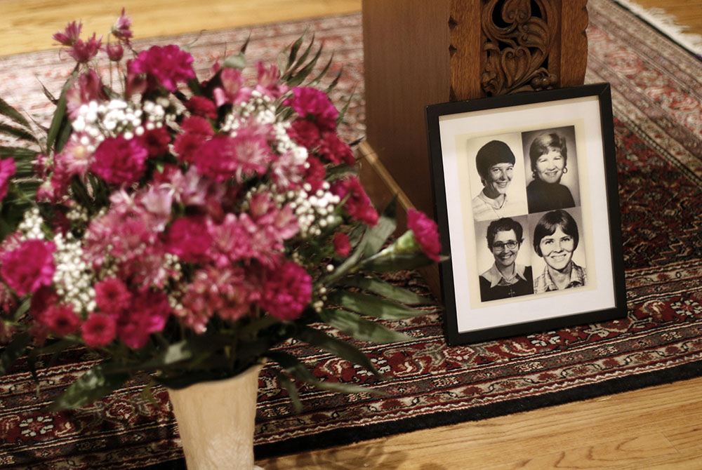 A framed photo of the four churchwomen who were murdered in El Salvador in 1980 is displayed in the sanctuary of Our Lady of the Miraculous Medal Church in Wyandanch, N.Y.  (CNS/Gregory A. Shemitz)