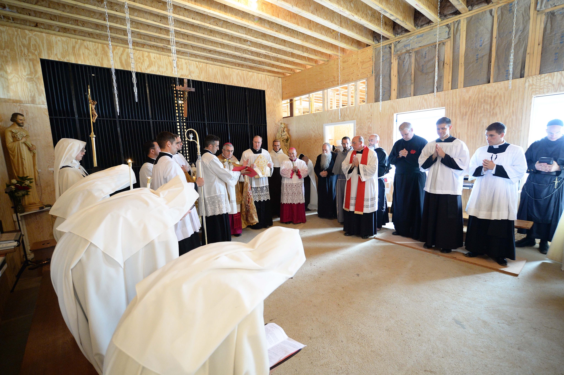 Clergy and Discalced Carmelite nuns gather in the temporary chapel at the Carmelite community July 25, 2018, in Fairfield, Pennsylvania, as Bishop Ronald Gainer of Harrisburg prepares to bless it. The Carmelite monastery in Philadelphia, which has existed