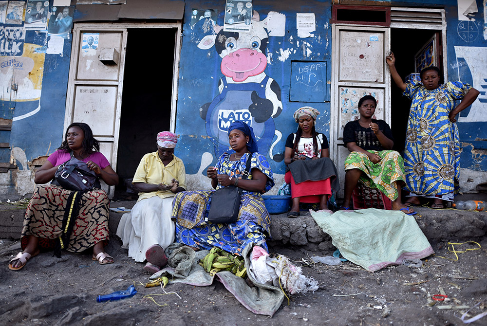 Women sit outside a dwelling amid concerns about the spread of the coronavirus disease March 23, 2020, in Goma, Congo. (CNS/Olivia Acland, Reuters)