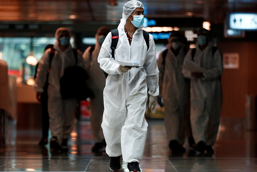 Seafarers who have spent months working onboard vessels during the COVID-19 pandemic arrive June 12, 2020, at Changi Airport in Singapore. (CNS/Edgar Su, Reuters) Seafarers who have spent months working onboard vessels during the COVID-19 pandemic arrive June 12, 2020, at Changi Airport in Singapore. (CNS/Edgar Su, Reuters)