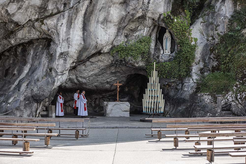 Empty pews are seen at the Shrine of Our Lady of Lourdes in France in early April 2020 during the COVID-19 pandemic. (CNS/JMP/ABACAPRESS.COM via Reuters/Thibaud Moritz)