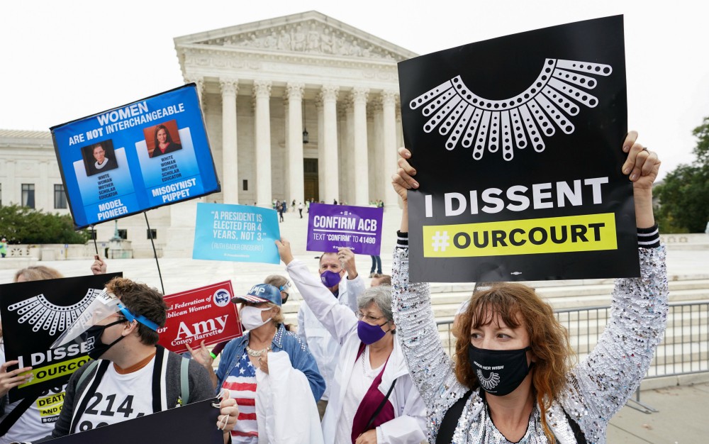 Demonstrators in Washington are seen near the Supreme Court building Oct. 13, during the Senate Judiciary Committee's confirmation hearing for President Donald Trump's nominee for the U.S. Supreme Court, Judge Amy Coney Barrett. (CNS/Reuters)
